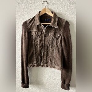 Warm brown corduroy jacket with knit sleeves.